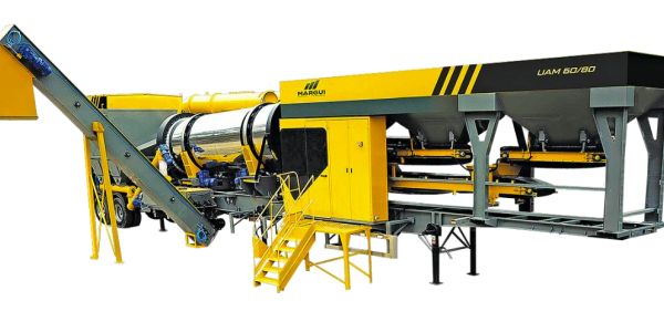 Large yellow and black industrial asphalt mixing machine.