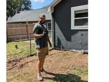 Andrew giving a thumbs-up after a successful brush removal job. Property maintenance in Michigan.