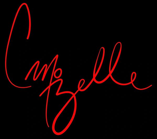 Red cursive signature on a black background.