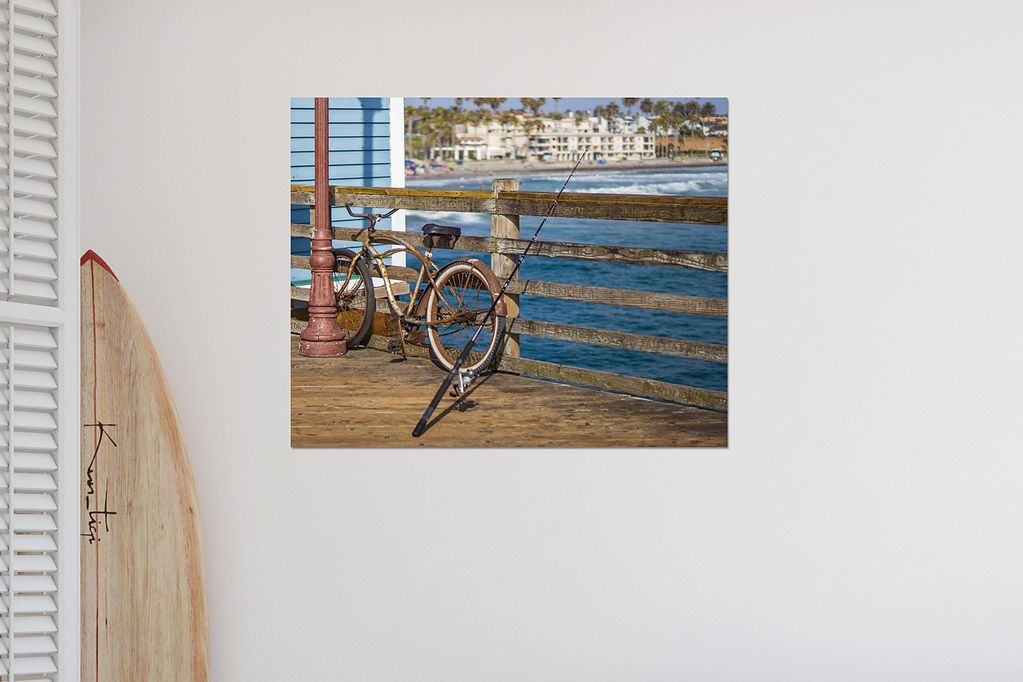 Rusty bike and fishing pool sitting on Oceanside Pier Wall decor.