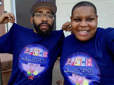 Owners wearing their uniform shirts during delivery of machines to a new location.