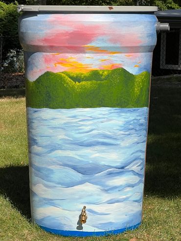 Painted water barrel with landscape scene.