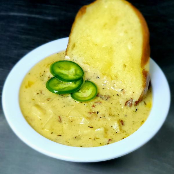 Loaded Potato soup; bacon, gouda, herbs, shown here with jalapeno & a butter toasted pretzel crouton