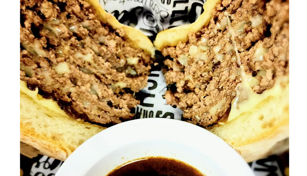 Five Smash Patties one stacked burger Swiss cheese in every layer, caramelized onion, House Au Jus