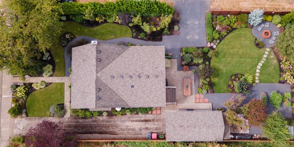 Aerial photo of a Craftsman style house and it's intricate gardens in Carlton, Oregon, USA.