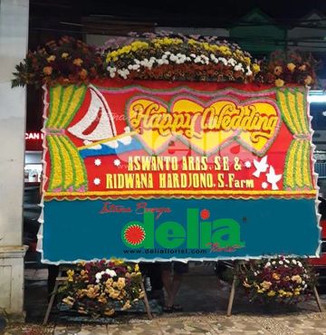 "Bunga Papan Makassar - Jual bunga papan tradisional Makassar yang indah dan unik". 