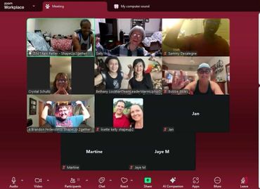 Zoom meeting with participants flexing muscles and smiling.