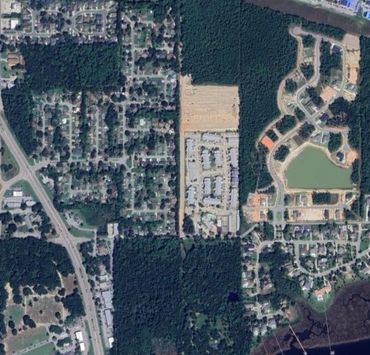 Aerial view of suburban and forest areas.
