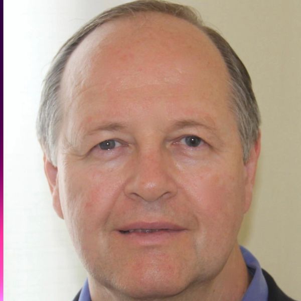 Portrait of a middle-aged man with light skin and blue eyes.