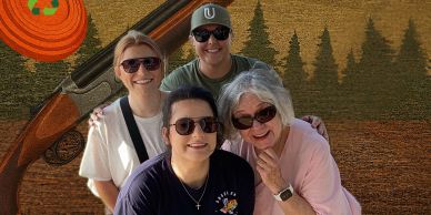 Four women smiling outdoors with a rustic background.