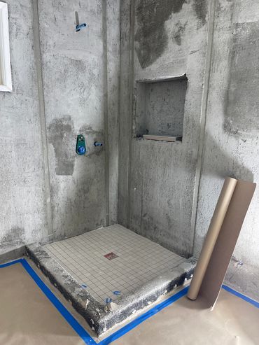 Waterproof membrane, then metal lath and then cement preparation for long lasting  tile setting.