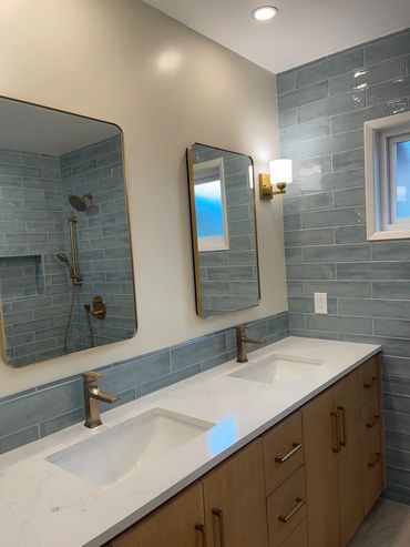 Brand new double sink installed with new individual medicine cabinets, new sconces a recessed lights
