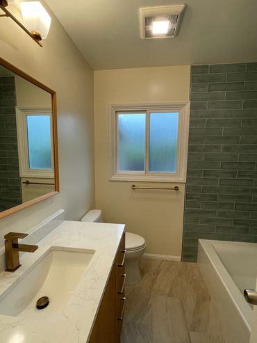 Modern bathroom with white and grey tones.