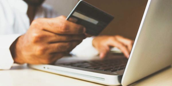 A man holding a credit card