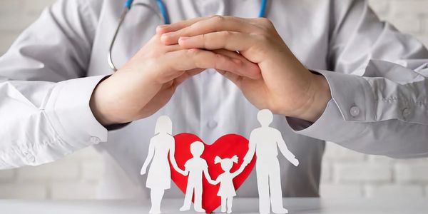 A doctor holding his hands as an umbrella representing health insurance