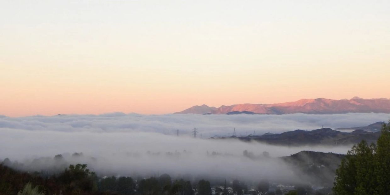 A drone photo of foggy Valencia, CA