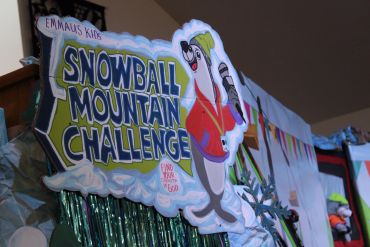 Snowball Mountain Challenge sign with cartoon character.
