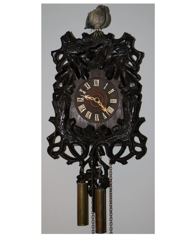 cuckoo clock with exposed life sized cuckoo bird