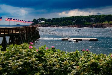 James Pier with American flag and flowers