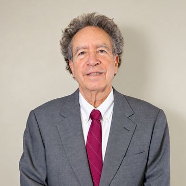 Man in gray suit with red tie.