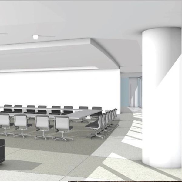 Modern conference room with people talking.