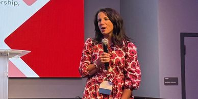 Speaker discusses ending mean girl culture through mentorship, not competition.