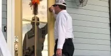 Electrician standing at the client's door for a service call in Fort Greene, Brooklyn, NY 