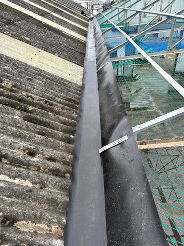 Asbestos gutter lined with HD sharman