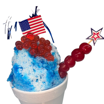 Blue shaved ice dessert with red toppings and American flag decoration.