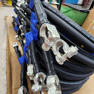 Coiled black cables with metal connectors.