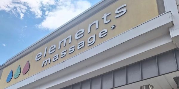 Storefront sign for Elements Massage.