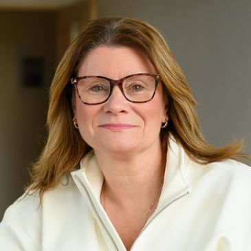 Woman with glasses smiling