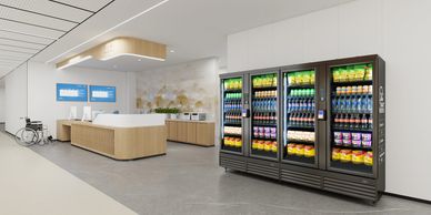 Modern hospital reception with vending machines and wheelchair.