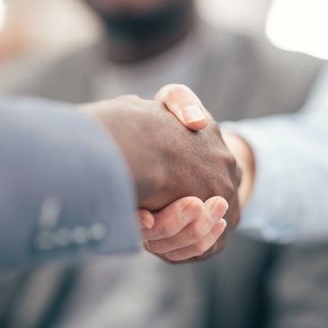 Picture of two people shaking hands. 