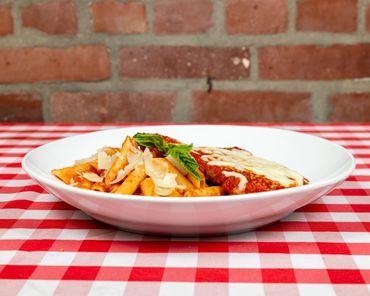 A plate of pasta and grilled bread 