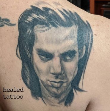 Nick Cave portrait tattoo by Jesse Sweeney