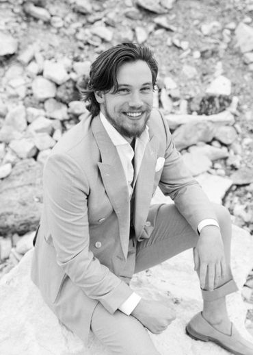 A black and white image of Jared wearing a double breasted made-to-measure suit