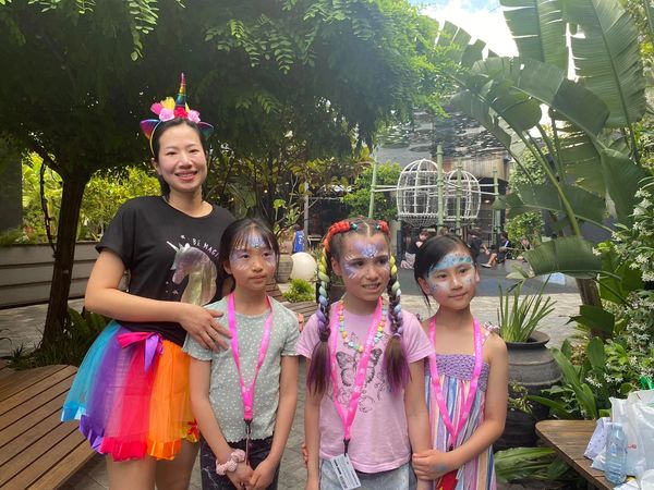 Face painter Tina with some satisfied customers.
