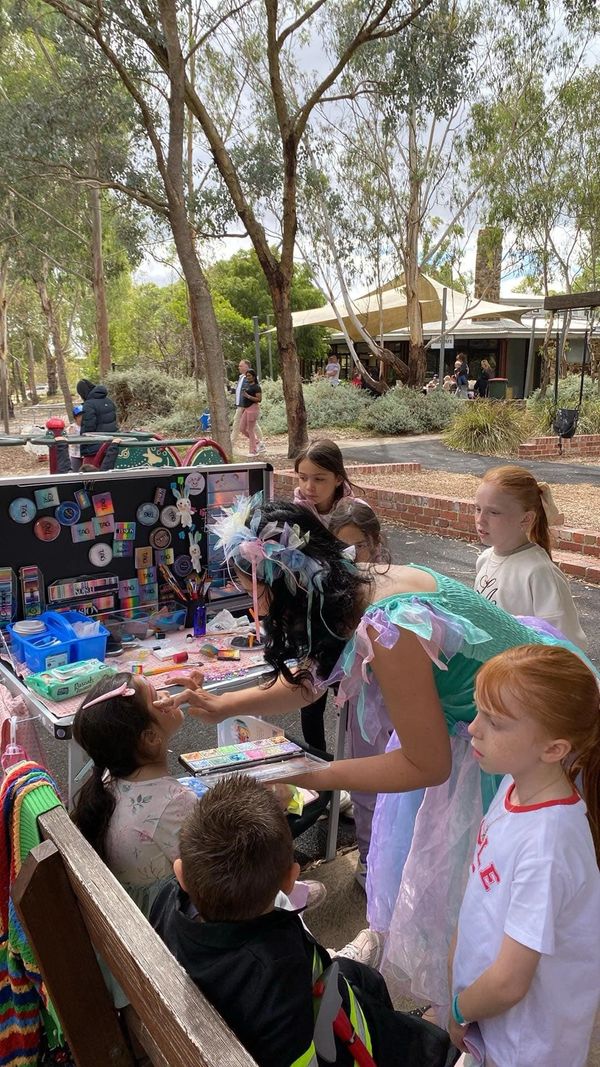 artist Tina doing face painting at Bundoora park