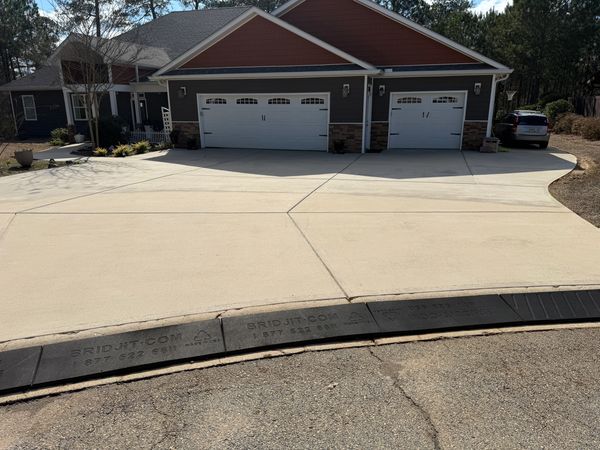 Concrete driveway after professional cleaning in Macon GA by Georgia Grime Fighters