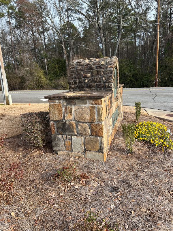 Dirty stone subdivision entrance. 