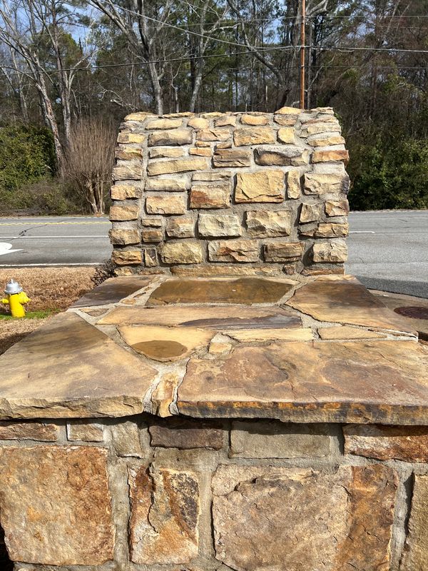Clean stone subdivision entrance. 