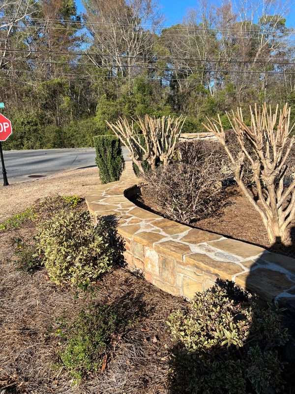 Stone retaining wall, clean.