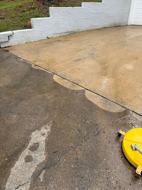 Professional concrete pressure washing in progress by Georgia Grime Fighters