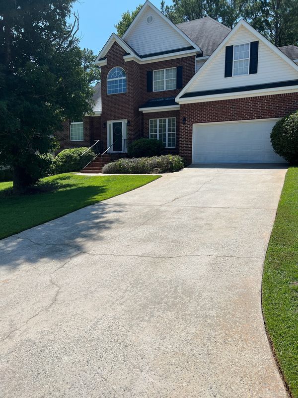Concrete driveway after professional pressure washing and concrete cleaning by Georgia Grime Fighter
