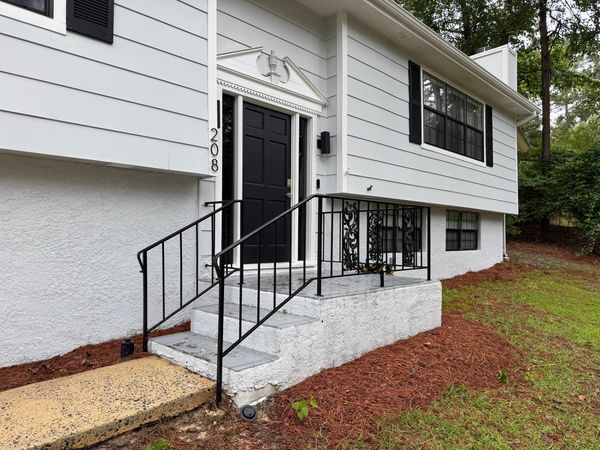 Clean home exterior and front steps after professional soft washing by Georgia Grime Fighters