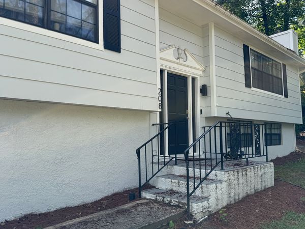 Home exterior and front steps before professional soft washing