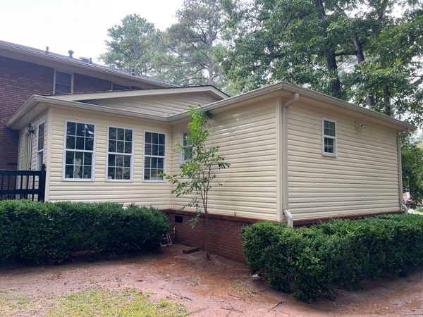 Clean vinyl siding after professional soft wash house washing by Georgia Grime Fighters in Macon, GA