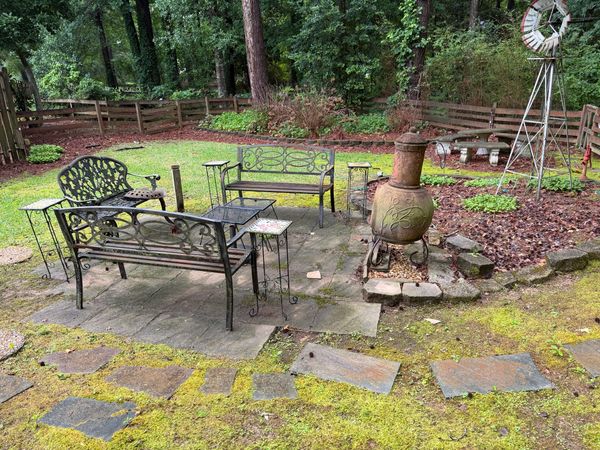 Outdoor patio and paver area with heavy algae, moss and organic buildup before professional cleaning