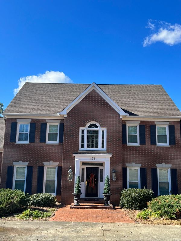 Clean asphalt shingle roof after professional roof cleaning in Macon GA